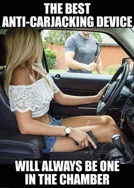 A woman in a vehicle brandishing a firearm at an approaching man who is threatening her.