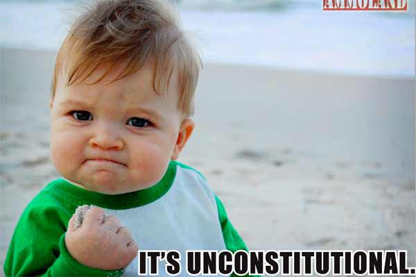 A determined baby with a clenched fist stands on a beach, featuring the text "IT'S UNCONSTITUTIONAL!" at the bottom.