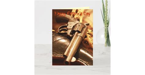 A Father's Day card featuring a close-up image of a revolver with the text "Happy Father's Day" at the top.